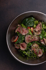 Delicious Salad with Meat and Arugula