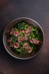 Delicious Salad with Meat and Arugula