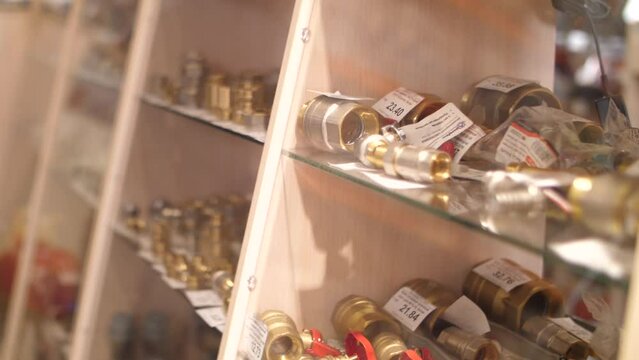 Plumbing shop with various spare and metal parts on display.