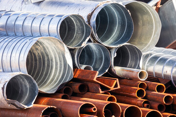 Pile of used metal tubes for air ventilation and water systems
