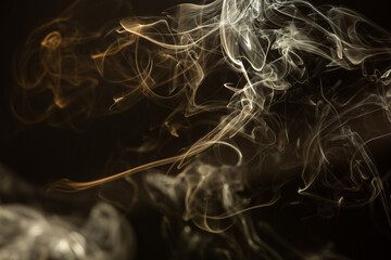 White smoke lingering on black background