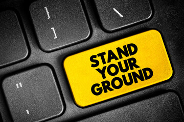 Stand Your Ground text button on keyboard, concept background - obrazy, fototapety, plakaty