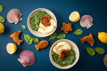 Gebratene Fischstäbchen Figuren als Fisch, Anker, Seestern und Delfin für Kinder mit Rahmspinat...