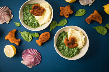 Gebratene Fischstäbchen Figuren als Fisch, Anker, Seestern und Delfin für Kinder mit Rahmspinat...