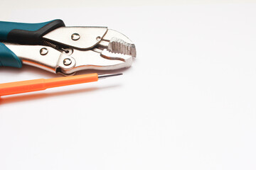 Tools for pliers on a white background, close-up.