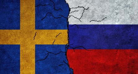 Sweden and Russia flag together on a cracked wall. Diplomatic relations between Russia and Sweden