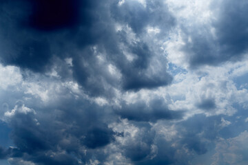 Cumulus clouds in the blue sky close-up, among the clouds,  atmospheric disturbance, inclement weather, atmospheric occurrence
