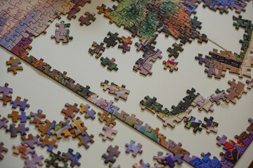 Puzzle half way complete with the remaining pieces scattered.