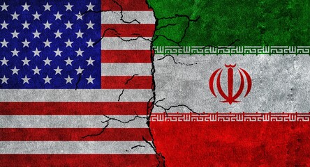 USA and Iran flag together on a cracked wall. Iran and United States of America diplomatic relations