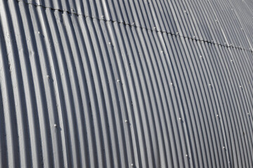 Corrugated galvanized steel panels on the exterior of a building. For background, wallpaper or...