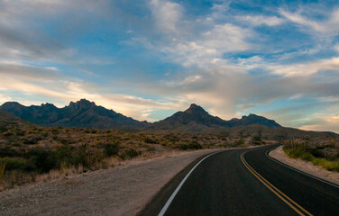 Pink clouds over the road in the stone desert near Santa Elena Canyon in Big Bend NP