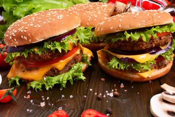 Hamburgers of the best products on a wooden background