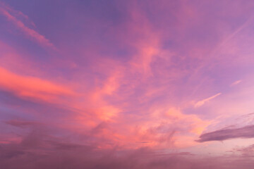 Epic Dramatic soft sunrise, sunset pink purple violet orange sky with cirrus clouds in sunlight...