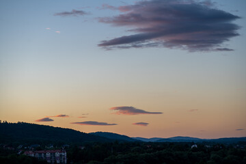 Beautiful sunset in the mountains with red clouds in the sky.