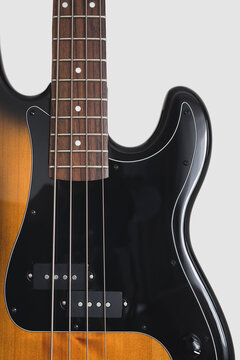 Brown bass guitar on white background