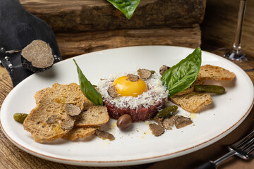 Fresh Tatar on a plate. Close-up