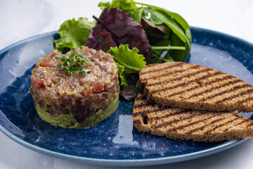 Fresh Tatar on a plate. Close-up