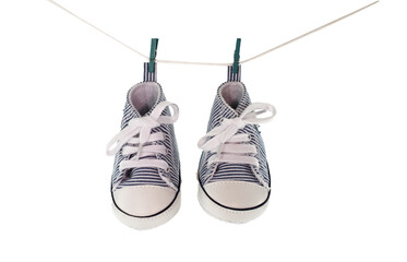 baby shoes hanging, concept for new born card - 686733904
