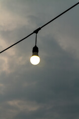 Lamp on the background of the cloudy sky in the evening.