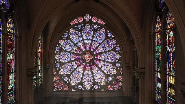 Intricate rose window with biblical imagery.
