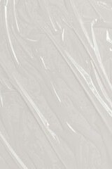 Plastic transparent on white background. White plastic film wrap texture background. White Plastic...
