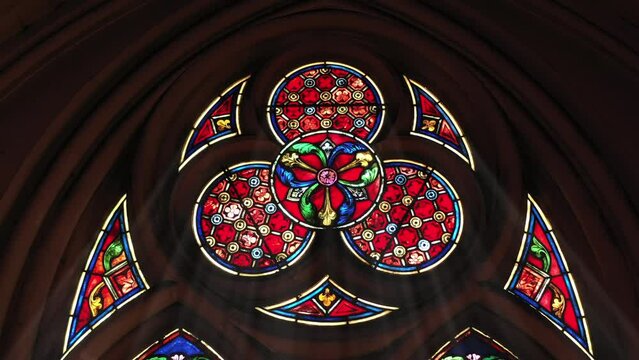 Timeless stained-glass craftsmanship in holy space.