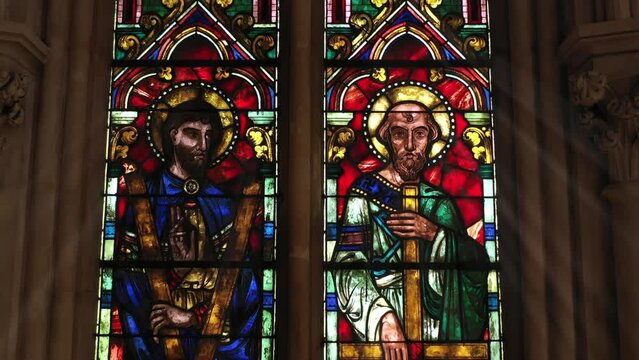 Historic church window featuring celestial beings.