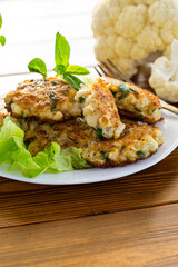 cooked vegetarian fried cauliflower cutlets in a plate