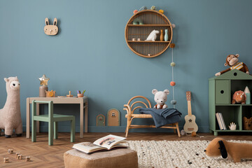 Cozy composition of kid room interior with round shelf, gray desk, green armchair, blue wall,...
