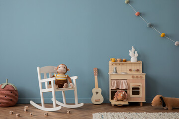 Cozy composition of living room interior with gray desk, green chair, guitar, kitchen for kids,...