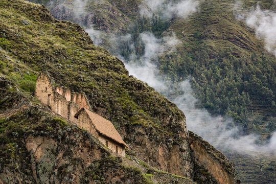 Storehouse or qullqas built by the Incas out of fieldstones on the hills surrounding Ollantaytambo; Ollantaytambo, Cuzco, Peru