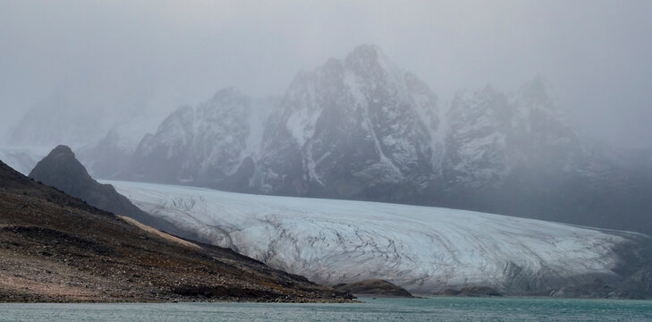 Tidewater glaciers move downstream right to the ocean's edge; Spitsbergen, Liefdefjorden, Svalbard, Norway