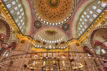 Interior of the Suleymaniye Mosque, view of domed ceiling and light fixtures, built beginning in 1550, Unesco World Heritage Site; Istanbul, Turkey