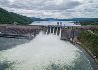 Aerial view of water discharge at hydroelectric power plant