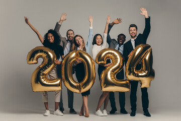 Happy business team in formalwear holding 2024 numbers while celebrating New Year  - obrazy, fototapety, plakaty