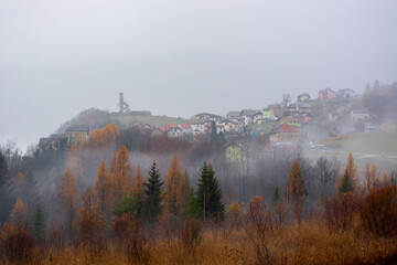 the small town of San Martino in Alpago in the province of Belluno now covered in autumn fog