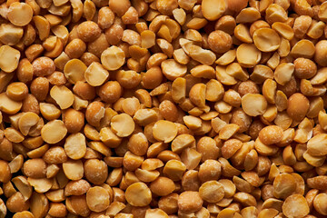 Grain texture background of dry yellow peas, macro shot with copy space