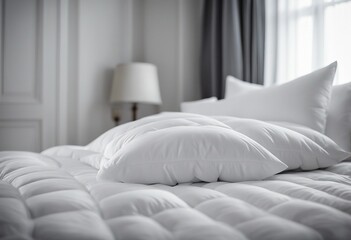 White folded duvet lying on white bed background Preparing for winter season household domestic act