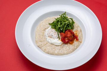 Breakfast - Oatmeal with poached egg and tomatoes