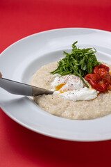 Breakfast - Oatmeal with poached egg and tomatoes