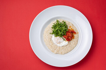 Breakfast - Oatmeal with poached egg and tomatoes