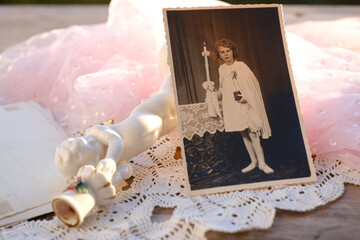 close-up old photographs, porcelain figurine, candlestick Small cupid of Love with golden wings,...