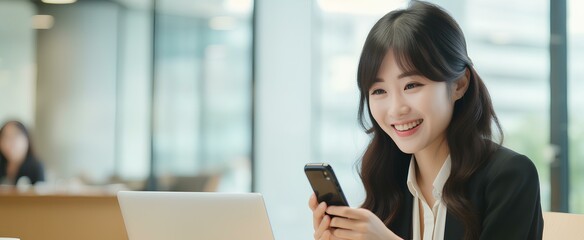japanese business woman holding phone using cellphone in office. Smiling professional businesswoman executive using smartphone cell mobile apps on cellphone working sitting at desk. generative AI - Powered by Adobe
