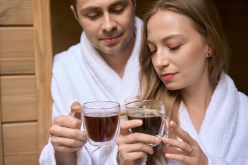 Married man and woman drinking hot morning beverage