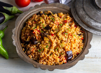 Traditional delicious Turkish food; Bulgur pilaf with eggplant and vegetables. (Turkish name; Patlicanli bulgur pilavi)