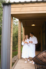Cute couple having morning walk on porch