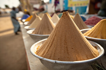 Pyramids of spices and color powder on Egyptian market in Aswan Egypt - obrazy, fototapety, plakaty