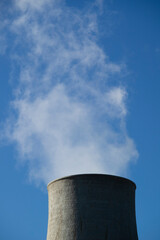 Photographic view of the steam cooling chimney coming from underground