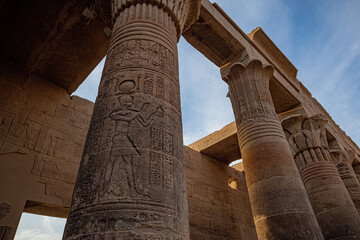 Details of Philae temple in Aswan Upper Egypt. Stone carved pillars with Egyptian god images