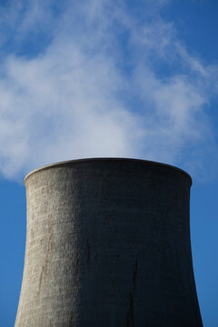 Photographic view of the steam cooling chimney coming from underground
